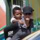 Sandra Bullock gives her son Louis a piggyback ride as she picks him up from school in Los Angeles on March 26, 2013