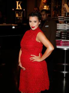 Red hot mama! Kim Kardashian arrives at the Kardashian Khaos store at The Mirage Hotel & Casino in Las Vegas on April 13, 2013 