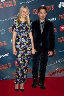 Gwyneth Paltrow and Robert Downey Jr. pose during the ‘Iron Man 3’ photocall at Le Grand Rex in Paris on April 14, 2013