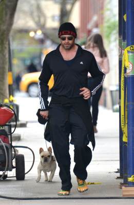 Hugh Jackman goes out for a morning jog — with his adorable pup in tow — in New York City on April 15, 2013