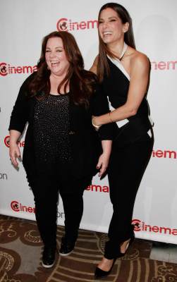 Melissa McCarthy and Sandra Bullock arrive at the 20th Century Fox Cinemacon Press Conference at Caesars Palace during CinemaCon 2013 on April 18, 2013 in Las Vegas