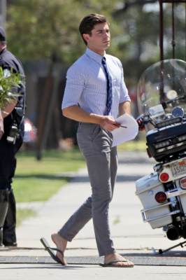 Business up top, party on the bottom! Zac Efron pairs his shirt & tie with flip flops on the set of ‘Townies’ in Los Angeles on April 22, 2013