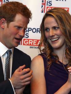Prince Harry chats with Missy Franklin at a reception at the Sanctuary Golf Course on May 10, 2013 in Sedalia, Colorado