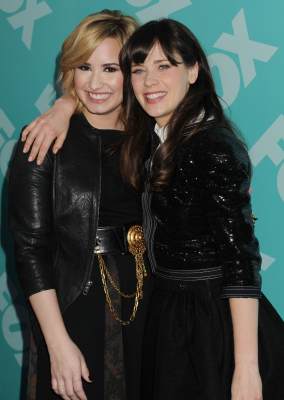 Demi Lovato and Zooey Deschanel attend the FOX 2103 Programming Presentation Post-Party at Wollman Rink in Central Park on May 13, 2013 in New York City