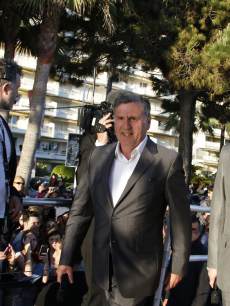 French actor and member of the Feature Film Jury Daniel Auteuil (C) and Austrian actor and member of the Feature Film Jury Christoph Waltz arrive to take part in the TV show ‘Le Grand Journal’ on the set of French TV Canal+ during the 66th Cannes film festival on May 17, 2013 in Cannes