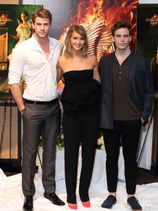 Liam Hemsworth, Jennifer Lawrence and Sam Claflin are seen at the photocall for ‘The Hunger Games: Catching Fire’ at The 66th Annual Cannes Film Festival at Majestic Hotel on May 18, 2013 in Cannes, France