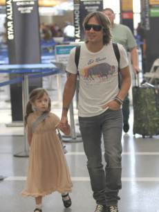 Cute! Keith Urban and daughter Sunday Rose spotted at LAX airport in Los Angeles on May 17, 2013