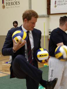 Prince Harry shows off his fancy footwork during his visit to Tedworth House to officially open the charity’s Tedworth House recovery centre on May 20, 2013 in Tidworth, England