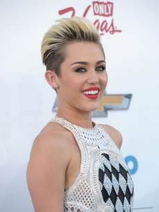 Miley Cyrus arrives at the 2013 Billboard Music Awards at the MGM Grand Garden Arena on May 19, 2013 in Las Vegas
