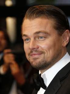 Leonardo DiCaprio smiles on May 15, 2013 as he arrives for the screening of the film ‘The Great Gatsby’ ahead of the opening of the 66th edition of the Cannes Film Festival in Cannes