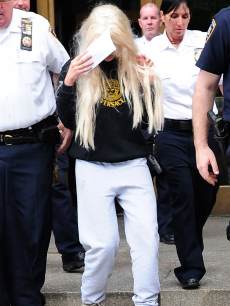 Amanda Bynes departs Manhattan Central Booking after being arrested on May 23 2013 for alleged charges of reckless endangerment, tampering with evidence and criminal possession of marijuana at Manhattan Criminal Court on May 24, 2013 in New York City