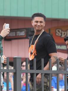 Vinny Guadagnino, Paul DelVecchio and Nicole Polizzi of ‘The Jersey Shore’ watch when the music group fun. performs on NBC’s ‘Today’on the beach at the Seaside Heights Boardwalk on May 24, 2013