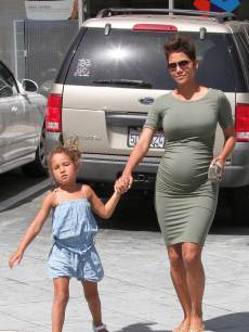 Pregnant Halle Berry holds hands with daughter Nahla while out and about in Los Angeles on May 24, 2013