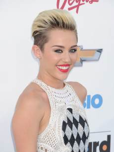 Miley Cyrus arrives at the 2013 Billboard Music Awards at the MGM Grand Garden Arena on May 19, 2013 in Las Vegas