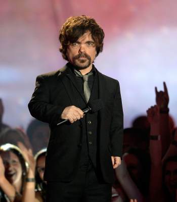 Peter Dinklage speaks onstage during the 2013 MTV Movie Awards at Sony Pictures Studios on April 14, 2013 in Culver City