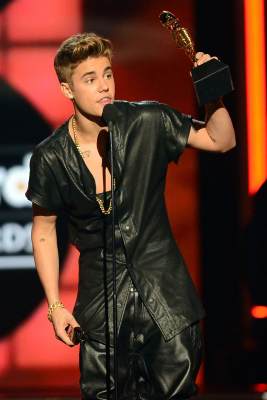 Justin Bieber accepts the award for ‘Top Male Artist’ onstage during the 2013 Billboard Music Awards at the MGM Grand Garden Arena on May 19, 2013 in Las Vegas