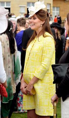 Britain’s Catherine, Duchess of Cambridge attends a garden party at Buckingham Palace in London May 22, 2013