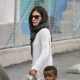 Sandra Bullock leads her son Louis into his school in Los Angeles on May 21, 2013