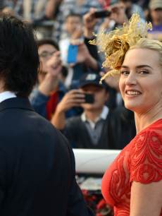 Ned Rocknroll and Kate Winslet attend the Longines Hong Kong Cup Race at the Hong Kong International Races at the Shatin racecourse in Hong Kong, December 9, 2012