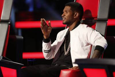 Usher critiques a contestant during the Top 6 performance night on ‘The Voice’