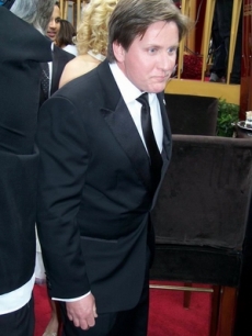 Emilio Estevez wanders in