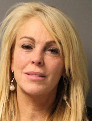 Dina Lohan is seen in a police booking photo after her arrest for DWI, Driving While Intoxicated, and speeding September 12, 2013 in Oyster Bay, New York