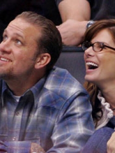 With husband Jesse James at an LA Kings game, Nov. 2005