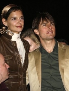 Katie Holmes and Tom Cruise look awed by the music