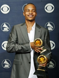 T.I. poses with his awards