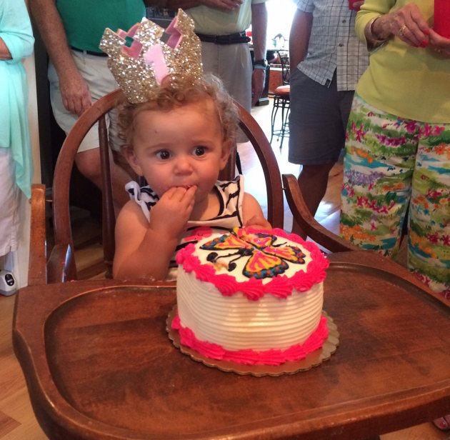 Ryan Patterson’s daughter Jasper enjoys her smash cake and birthday crown