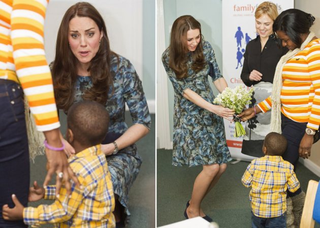 Duchess Kate gets flowers from a shy toddler in London on January 19, 2015 (Getty)