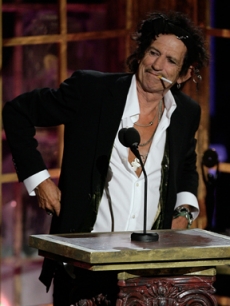 Keith Richards lights a cig while presenting at the Hall of Fame