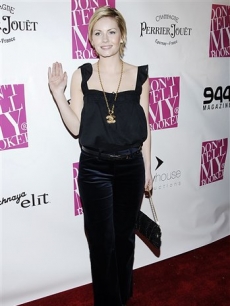 Elisha Cuthbert follows close behind