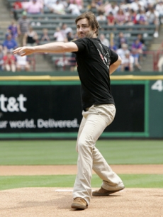 Luke throws out an opening pitch