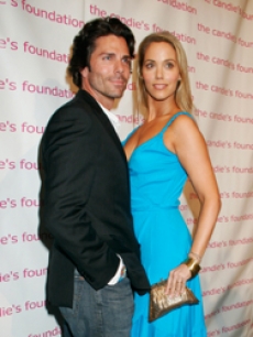 Elizabeth Berkley and hubby, Greg, pose at the charity party