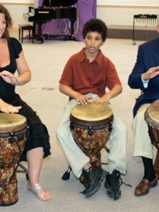 Sarah McLachlan plays drums during a music program in Vancouver