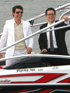 Tom Cruise and director J.J. Abrams arrive via boat to the Tokyo screening