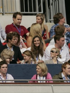 Prince William's girlfriend Kate Middleton watches from their box