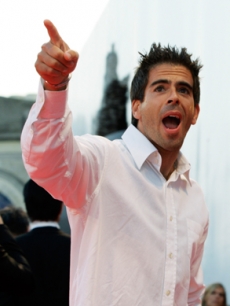 Director Eli Roth gestures to the crowd in Italy