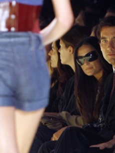 Demi Moore and Clive owen check out the Miss Sixty runway show