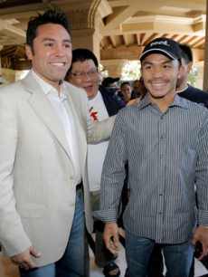 Oscar de la Hoya greets boxer Manny Pacquiao in Las Vegas