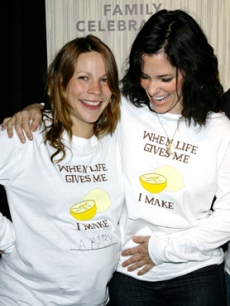 Lili Taylor shows off her baby bump to Parker Posey at the gala