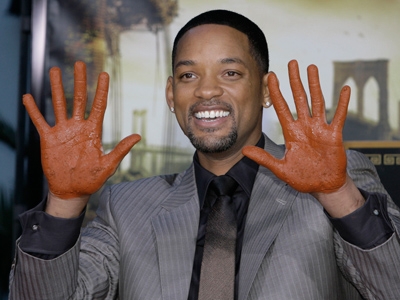 Will Smith puts his hands in cement in Hollywood...