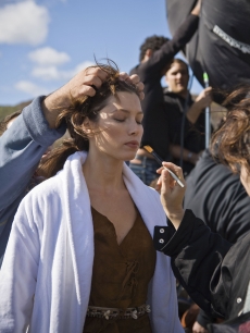Jessica Biel has makeup applied on the set of a photo shoot 