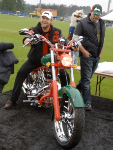 Russell Crowe, co-owner of the Rabbitohs rugby team, tries out his new Rabbitohs themed motorcycle