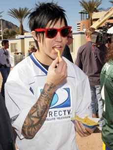 Pete Wentz eats french fries at the DirectTV Beach Bowl in Scottsdale