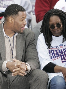 NY Giants Michael Strahan with Whoopi Goldberg during a victory ceremony