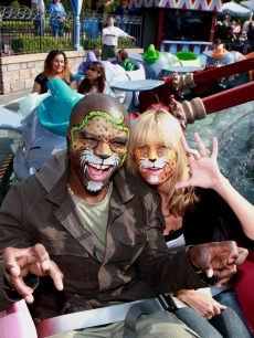Heidi Klum and hubby Seal get their faces painted a ride 'Dumbo' at Disneyland!