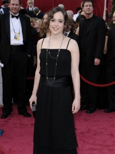 Best Actress nominee Ellen Page smiles on the red carpet