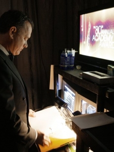 Tom Hanks reads over an Oscar script